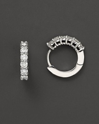 Small diamond earrings; with signature ruby accent. Post back for pierced ears. Designed by Roberto Coin. Small diamond earrings; with signature ruby accent. Post back for pierced ears. Designed by Roberto Coin.