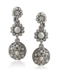 Add a little frosting with these icy white drops by Carolee. Sweet and sumptuous, earrings feature white glass pearls and sparkling glass crystals. Crafted in silvertone mixed metal. Brass clip backing. Approximate drop: 1-1/2 inches. Add a little frosting with these icy white drops by Carolee. Sweet and sumptuous, earrings feature white glass pearls and sparkling glass crystals. Crafted in silvertone mixed metal. Brass clip backing. Approximate drop: 1-1/2 inches.