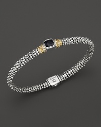 Faceted black spinel is trimmed in yellow gold and sterling silver, accented with diamonds for a sparkling finish. From Lagos. Faceted black spinel is trimmed in yellow gold and sterling silver, accented with diamonds for a sparkling finish. From Lagos.