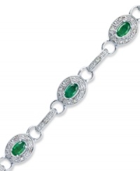 Enviable sparkle that everyone will want to get their hands on. This glam tennis bracelet highlights oval-cut emeralds (2 ct. t.w.) and round-cut diamonds (1/4 ct. t.w.) in sterling silver. Approximate length: 7-1/4 inches. Enviable sparkle that everyone will want to get their hands on. This glam tennis bracelet highlights oval-cut emeralds (2 ct. t.w.) and round-cut diamonds (1/4 ct. t.w.) in sterling silver. Approximate length: 7-1/4 inches.