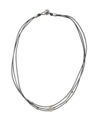 Channel peace, love, and fab style. Fossil design epitomizes hippie-chic with three strands of chocolate leather cords strung with metallic nuggets. Beads and button closure crafted in silver tone mixed metal. Approximate length: 17 inches. Channel peace, love, and fab style. Fossil design epitomizes hippie-chic with three strands of chocolate leather cords strung with metallic nuggets. Beads and button closure crafted in silver tone mixed metal. Approximate length: 17 inches.