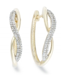 Up your glam factor. YellOra™'s chic spiraling hoop earrings showcase round-cut diamonds front and center (1/3 ct. t.w.). Precious metal made from a combination of pure gold, sterling silver and palladium. Approximate diameter: 3/4 inch. Up your glam factor. YellOra™'s chic spiraling hoop earrings showcase round-cut diamonds front and center (1/3 ct. t.w.). Precious metal made from a combination of pure gold, sterling silver and palladium. Approximate diameter: 3/4 inch.
