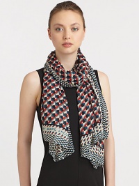 A woven modal scarf is embellished with a colorful print with contrasting border.ModalAbout 65 X 46Dry cleanImported