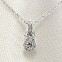 Everlon Love Knot Pave Diamond Pendant With 0.61 Carats Diamonds. Everlon Love Knot Pave Diamond Pendant With 0.61 Carats Diamonds.