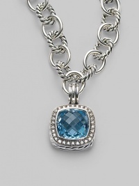 A sparkling faceted blue topaz, surrounded by pavé diamonds, sits in a squared setting of sterling silver with a cabled edge and fluted bale. Blue topaz Diamonds, 0.45 tcw Sterling silver with a black rhodium finish About ¾ square Spring clip clasp Made in USA Please note: Necklace sold separately. A sparkling faceted blue topaz, surrounded by pavé diamonds, sits in a squared setting of sterling silver with a cabled edge and fluted bale. Blue topaz Diamonds, 0.45 tcw Sterling silver with a black rhodium finish About ¾ square Spring clip clasp Made in USA Please note: Necklace sold separately.