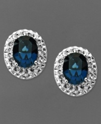 Startling baby blues. Oval-shaped blue crystals adorn Kaleidsocope's knock out stud earrings. Crafted in sterling silver with Swarovski Elements. Approximate drop length: 6/8 inch. Approximate drop width: 1/2 inch. Startling baby blues. Oval-shaped blue crystals adorn Kaleidsocope's knock out stud earrings. Crafted in sterling silver with Swarovski Elements. Approximate drop length: 6/8 inch. Approximate drop width: 1/2 inch.