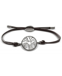 Plant your roots in rich fashion. This Fossil bracelet features a polished steel coin pendant with cut-out tree detail. Strung on an adjustable chocolate brown leather cord. Approximate diameter: 2-1/2 inches. Plant your roots in rich fashion. This Fossil bracelet features a polished steel coin pendant with cut-out tree detail. Strung on an adjustable chocolate brown leather cord. Approximate diameter: 2-1/2 inches.