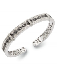 A style refresh. Stunning round-cut white diamonds (3/10 ct. t.w.) and black diamonds (1/10 ct. t.w.) form a sophisticated pattern on this sparkling bangle. Set in sterling silver. Approximate diameter: 3-1/2 inches. A style refresh. Stunning round-cut white diamonds (3/10 ct. t.w.) and black diamonds (1/10 ct. t.w.) form a sophisticated pattern on this sparkling bangle. Set in sterling silver. Approximate diameter: 3-1/2 inches.
