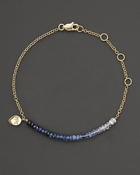 In graduated hues, rough-cut sapphire briolettes adorn a 14K gold chain. In graduated hues, rough-cut sapphire briolettes adorn a 14K gold chain.