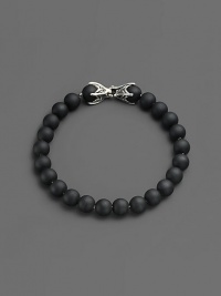 A versatile look that matches any ensemble, is laced with matte onyx beads and joined together by a sterling silver chevron clasp.Sterling silver chevron clasp8 mm beadsAbout 8½ longImported A versatile look that matches any ensemble, is laced with matte onyx beads and joined together by a sterling silver chevron clasp.Sterling silver chevron clasp8 mm beadsAbout 8½ longImported