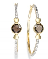 Stylish sophistication by Victoria Townsend. A traditional pair of hoop earrings gets played up by round-cut smokey topaz (2-5/8 ct. t.w.) and sparkling diamond accents. Set in 18k gold over sterling silver and sterling silver. Approximate diameter: 1-5/8 inches. Stylish sophistication by Victoria Townsend. A traditional pair of hoop earrings gets played up by round-cut smokey topaz (2-5/8 ct. t.w.) and sparkling diamond accents. Set in 18k gold over sterling silver and sterling silver. Approximate diameter: 1-5/8 inches.