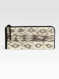 Carry your essentials in this textured leather design for an exotic-inspired look. Zip-around topOne inner zip compartmentEight credit card slots7¾W X 3½H X ¾DImported Carry your essentials in this textured leather design for an exotic-inspired look. Zip-around topOne inner zip compartmentEight credit card slots7¾W X 3½H X ¾DImported