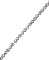 A timeless classic that can be worn alone or paired with other bracelets for a chic layered look. Swarovski's tennis bracelet features sparkling clear crystals in silver tone mixed metal. Approximate length: 7-1/2 inches. A timeless classic that can be worn alone or paired with other bracelets for a chic layered look. Swarovski's tennis bracelet features sparkling clear crystals in silver tone mixed metal. Approximate length: 7-1/2 inches.