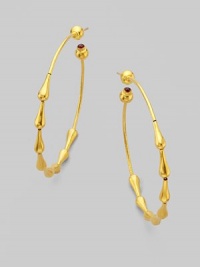 From the Spring Collection. Beautiful raindrops of 24k yellow gold trickle down in hoop shape and end with single ruby stones. 24k yellow gold Ruby Diameter, about 2 Post back Imported From the Spring Collection. Beautiful raindrops of 24k yellow gold trickle down in hoop shape and end with single ruby stones. 24k yellow gold Ruby Diameter, about 2 Post back Imported