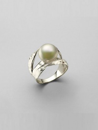 A single, shining organic pearl suspends over a hammered setting of rhodium-plated sterling silver. 12mm white, round man-made pearl Rhodium-plated sterling silver Made in Spain A single, shining organic pearl suspends over a hammered setting of rhodium-plated sterling silver. 12mm white, round man-made pearl Rhodium-plated sterling silver Made in Spain