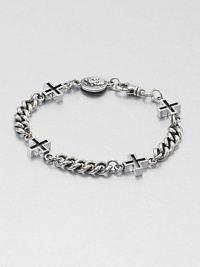 Cross chain bracelet with skull vintage coin detail of sterling silver with a polished finish and a lobster clasp closure.Sterling silverDiameter, about 3Lobster claspMade in USA Cross chain bracelet with skull vintage coin detail of sterling silver with a polished finish and a lobster clasp closure.Sterling silverDiameter, about 3Lobster claspMade in USA