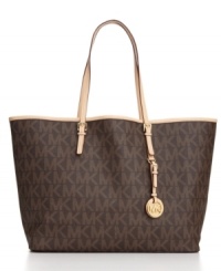 Bon voyage in style: Vachetta leather trim and an 18K gold logo charm embellish this monogram travel tote with luxe appeal. Bon voyage in style: Vachetta leather trim and an 18K gold logo charm embellish this monogram travel tote with luxe appeal.