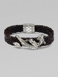 An intricately detailed sterling silver dragon wraps itself around a band of braided leather.SilverBraided leatherPush-lock claspAbout 8½ longAbout ¾ wideImported An intricately detailed sterling silver dragon wraps itself around a band of braided leather.SilverBraided leatherPush-lock claspAbout 8½ longAbout ¾ wideImported