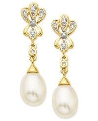 Go for the glamour. These drop earrings, crafted from 10k gold, dazzle with cultured freshwater pearls (7-9 mm) and diamond accents lending a shining touch. Approximate drop: 1-1/8 inch. Go for the glamour. These drop earrings, crafted from 10k gold, dazzle with cultured freshwater pearls (7-9 mm) and diamond accents lending a shining touch. Approximate drop: 1-1/8 inch.
