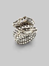 From the Naga Collection. A powerful dragon with dotted scales coils around the finger in this dramatic design. Sterling silver Width, about ¾ Made in Bali