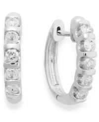 Lighten your look with luminous sparkle. Crafted in 14k white gold, these huggie hoop earrings delight with five, round-cut diamond stations (1/2 ct. t.w.). Approximate drop: 10-1/2 mm. Lighten your look with luminous sparkle. Crafted in 14k white gold, these huggie hoop earrings delight with five, round-cut diamond stations (1/2 ct. t.w.). Approximate drop: 10-1/2 mm.