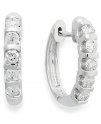 Lighten your look with luminous sparkle. Crafted in 14k white gold, these huggie hoop earrings delight with five, round-cut diamond stations (1/2 ct. t.w.). Approximate drop: 10-1/2 mm.