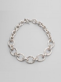 Chunky graduated links of hammered sterling silver make a bold and beautiful statement. Sterling silver Length, about 20 Toggle closure Imported