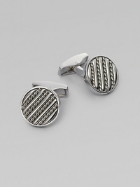 Round sterling silver links are set with hand-twisted wire inlaid within silver bars. Sterling silver About ½ diam. Made in the United Kingdom Round sterling silver links are set with hand-twisted wire inlaid within silver bars. Sterling silver About ½ diam. Made in the United Kingdom