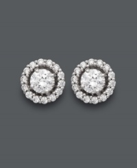 Spectacular sparkle. Arabella's unique stud earrings are out of this world! A luminous Swarovski zirconia center (2-7/8 ct. t.w.) shines extra bright when encircled by a halo of round-cut Swarovski zirconias. Post setting crafted in 14k white gold. Approximate diameter: 5 mm. Spectacular sparkle. Arabella's unique stud earrings are out of this world! A luminous Swarovski zirconia center (2-7/8 ct. t.w.) shines extra bright when encircled by a halo of round-cut Swarovski zirconias. Post setting crafted in 14k white gold. Approximate diameter: 5 mm.