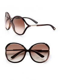 Oversized round sunglasses feature Tom Ford Signature tubular temples and floating lens with logo detail. Available in brown shimmer with gradient brown lens or black with grey lens.Signature tubular temples100% UV protectionMade in Italy Oversized round sunglasses feature Tom Ford Signature tubular temples and floating lens with logo detail. Available in brown shimmer with gradient brown lens or black with grey lens.Signature tubular temples100% UV protectionMade in Italy