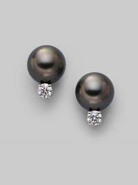From the South Sea Collection. Classic black cultured pearl studs with sparkling diamond accents, set in 18k gold. 8mm black round cultured pearls Quality: A+ Diamonds, 0.20 tcw 18k white gold Post back Imported From the South Sea Collection. Classic black cultured pearl studs with sparkling diamond accents, set in 18k gold. 8mm black round cultured pearls Quality: A+ Diamonds, 0.20 tcw 18k white gold Post back Imported