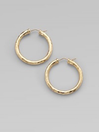 From the Martellato Collection. Graceful hoops with a rich hammered texture in gleaming 18k gold.18k yellow goldDiameter, about 1¼PiercedMade in Italy From the Martellato Collection. Graceful hoops with a rich hammered texture in gleaming 18k gold.18k yellow goldDiameter, about 1¼PiercedMade in Italy