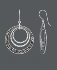 For a look that's out of this orbit -- just add Genevieve & Grace! Chic, circular rings shine with the addition of marcasite accents and an intricate rope edging. Crafted in sterling silver. Approximate drop: 1-3/4 inches. For a look that's out of this orbit -- just add Genevieve & Grace! Chic, circular rings shine with the addition of marcasite accents and an intricate rope edging. Crafted in sterling silver. Approximate drop: 1-3/4 inches.