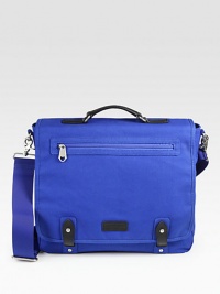 Converting from a briefcase to a shoulder bag to a backpack, this rugged and refined, leather-trimmed canvas bag holds your computer and lots else.Single top handleAdjustable, detachable shoulder strapTuck-away backpack strapsStud-and-tab flap closeOne outside zip flap pocketInside laptop compartment, zip pocket and organizerCotton lining15W X 13H X 4DImported Converting from a briefcase to a shoulder bag to a backpack, this rugged and refined, leather-trimmed canvas bag holds your computer and lots else.Single top handleAdjustable, detachable shoulder strapTuck-away backpack strapsStud-and-tab flap closeOne outside zip flap pocketInside laptop compartment, zip pocket and organizerCotton lining15W X 13H X 4DImported
