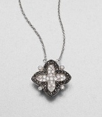 From the Soho Collection. This clover-shaped design features white sapphires and black spinels on a sterling silver link chain. White sapphiresBlack spinelSterling silverLength, about 16Pendant size, about .7Lobster clasp closureImported 