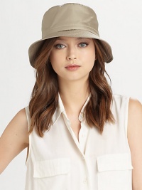 Stay dry in style with this portable, packable water-repellant must-have, elevated with an embossed snakeskin-print belt and goldtone hardware.Brim, about 3Adjustable with back belt detailElasticized inner bandWater-repellant nylonCotton liningSpot cleanMade in USA Stay dry in style with this portable, packable water-repellant must-have, elevated with an embossed snakeskin-print belt and goldtone hardware.Brim, about 3Adjustable with back belt detailElasticized inner bandWater-repellant nylonCotton liningSpot cleanMade in USA