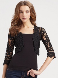 Cropped knit crafted with a beautiful ribbon embroidery for an eye-catching look.Three-quarter sleeves About 14 from shoulder to hem Rayon; dry clean Imported Cropped knit crafted with a beautiful ribbon embroidery for an eye-catching look.Three-quarter sleeves About 14 from shoulder to hem Rayon; dry clean Imported