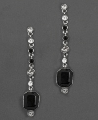 Play up the classic contrast of black and white with these dramatic and sophisticated drop earrings. With octagonal cut jet crystals and round-cut faceted clear and jet crystals hanging along a silverplate chain. Each measures 1.7 inches long. Play up the classic contrast of black and white with these dramatic and sophisticated drop earrings. With octagonal cut jet crystals and round-cut faceted clear and jet crystals hanging along a silverplate chain. Each measures 1.7 inches long.