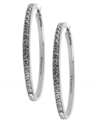 Go big this season. T Tahari blends silver tones with shimmering crystal studs on these large hoop earrings. Crafted in silver tone mixed metal. Base metal is nickel-free for sensitive skin. Approximate diameter: 1-1/4 inch. Go big this season. T Tahari blends silver tones with shimmering crystal studs on these large hoop earrings. Crafted in silver tone mixed metal. Base metal is nickel-free for sensitive skin. Approximate diameter: 1-1/4 inch.