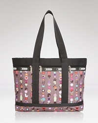Travel light with this LeSportsac nylon tote, which features a lined interior and effortless double top handles. A playful print updates this signature style. Travel light with this LeSportsac nylon tote, which features a lined interior and effortless double top handles. A playful print updates this signature style.