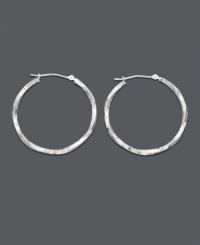 Elegant earrings with a chic twist. The perfect last minute accessory - hoop earrings crafted in 14k white gold with a unique twisted design. Approximate diameter: 1-1/4 inches. Elegant earrings with a chic twist. The perfect last minute accessory - hoop earrings crafted in 14k white gold with a unique twisted design. Approximate diameter: 1-1/4 inches.
