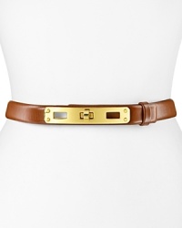 Buckle up. Impossibly effortless with signature details, this Tory Burch belt lends a distinctive touch to your waistline. Buckle up. Impossibly effortless with signature details, this Tory Burch belt lends a distinctive touch to your waistline.