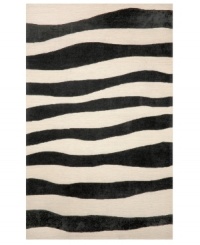A suggested zebra stripe adds a hint of wild energy to the Promenade Wavey Stripe area rug, while its tame color palette lends itself to any modern home décor. This unique home accent is intricately hand-tufted for crafted durability and supreme detailing in composition. A suggested zebra stripe adds a hint of wild energy to the Promenade Wavey Stripe area rug, while its tame color palette lends itself to any modern home décor. This unique home accent is intricately hand-tufted for crafted durability and supreme detailing in composition.