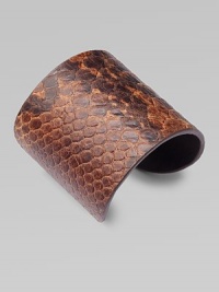 This lovely, python-print style feature a wide design for an impactful look. Python-print leatherMetal baseDiameter, about 2½Slip-on styleImported This lovely, python-print style feature a wide design for an impactful look. Python-print leatherMetal baseDiameter, about 2½Slip-on styleImported