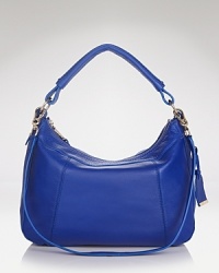 Slouchy and shoulder-right yet surprisingly sophisticated, this leather Cole Haan hobo is a you-wear-it-with-everything and take-it-everywhere kind of bag. Slouchy and shoulder-right yet surprisingly sophisticated, this leather Cole Haan hobo is a you-wear-it-with-everything and take-it-everywhere kind of bag.