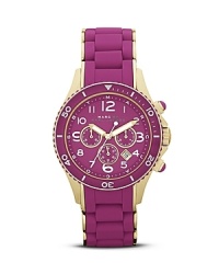 There's no need to shrink from vibrant style with this gold and purple watch from MARC BY MARC JACOBS. It features a date window and quartz movement for color-pop practicality. There's no need to shrink from vibrant style with this gold and purple watch from MARC BY MARC JACOBS. It features a date window and quartz movement for color-pop practicality.