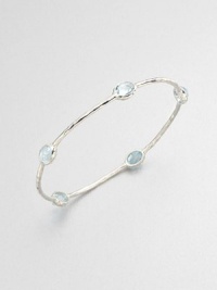 From the Rock Candy® Collection. Five faceted blue topaz stations set on a hammered sterling silver bangle. Blue topazSterling silverDiameter, about 2.5Slip-on styleImported From the Rock Candy® Collection. Five faceted blue topaz stations set on a hammered sterling silver bangle. Blue topazSterling silverDiameter, about 2.5Slip-on styleImported