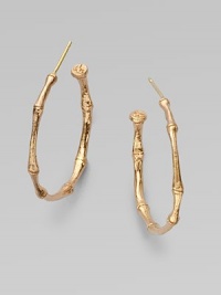 A bamboo hoop in 18K gold for a subtle twist to classic design.18K gold Diameter, about 1 Post backs Made in USA A bamboo hoop in 18K gold for a subtle twist to classic design.18K gold Diameter, about 1 Post backs Made in USA