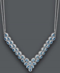 Give new meaning to a plunging neckline. This glamorous v-shaped necklace features two beautiful rows of oval-cut blue topaz (20 ct. t.w.). Set in sterling silver with a double chain design. Approximate length: 18 inches. Approximate drop width: 3 inches. Give new meaning to a plunging neckline. This glamorous v-shaped necklace features two beautiful rows of oval-cut blue topaz (20 ct. t.w.). Set in sterling silver with a double chain design. Approximate length: 18 inches. Approximate drop width: 3 inches.