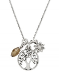 A nature-inspired necklace from Fossil. With a coin charm with cut-out tree detail, flower charm and faceted smoky quart cluster. Lobster claw closure. Crafted in shiny silver tone mixed metal. Approximate length: 16 inches + 1-inch extender. Approximate drop: 3/4 inch. A nature-inspired necklace from Fossil. With a coin charm with cut-out tree detail, flower charm and faceted smoky quart cluster. Lobster claw closure. Crafted in shiny silver tone mixed metal. Approximate length: 16 inches + 1-inch extender. Approximate drop: 3/4 inch.